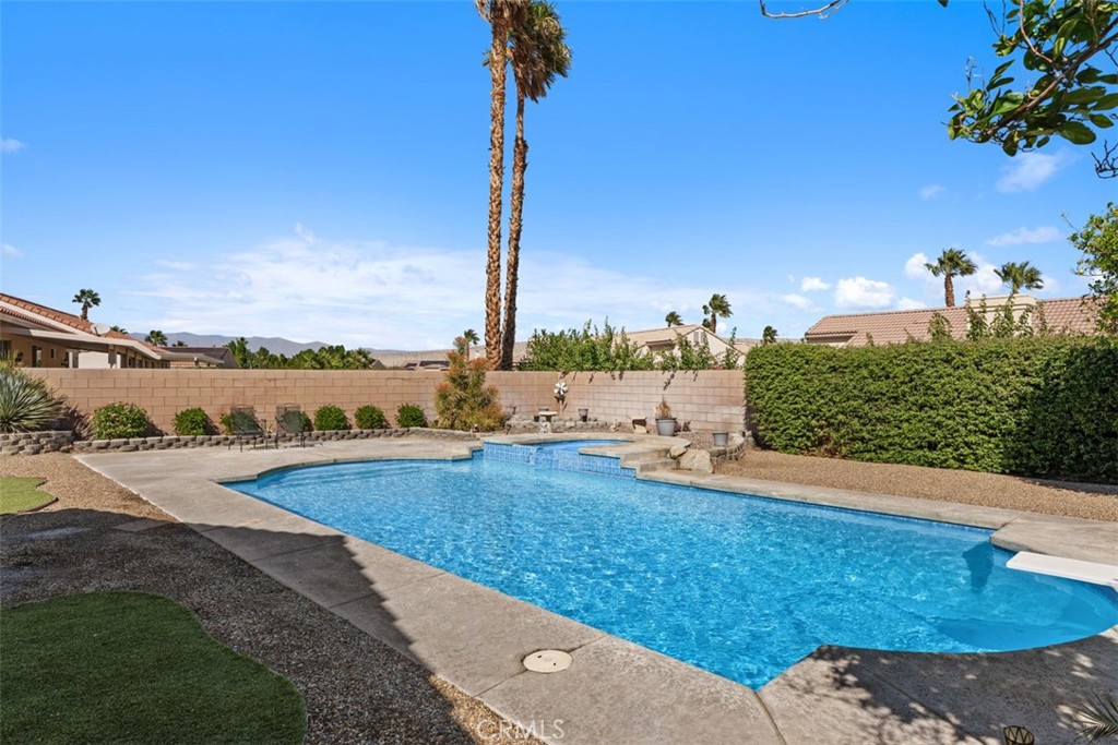 68262 Pasada Road Cathedral City, CA 92234 - Photo 24 of 27 a view of a swimming pool with a yard