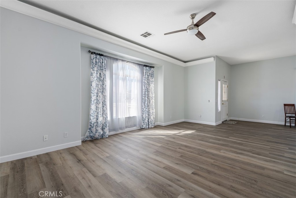 68262 Pasada Road Cathedral City, CA 92234 - Photo 7 of 27 wooden floor in an empty room with a window