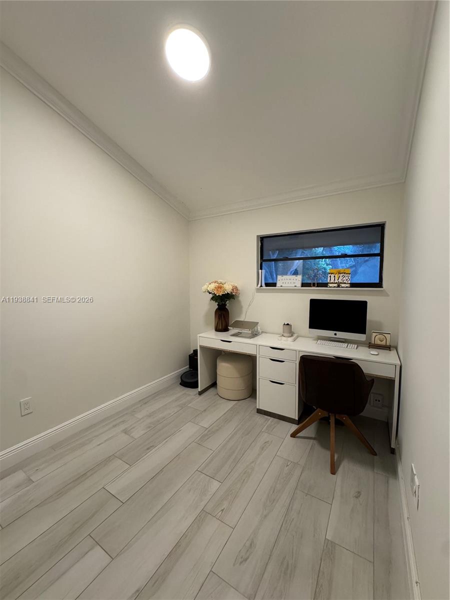 10069 Southwest 77th Court Miami, FL 33156 - Photo 12 of 16 a room with furniture and a dresser