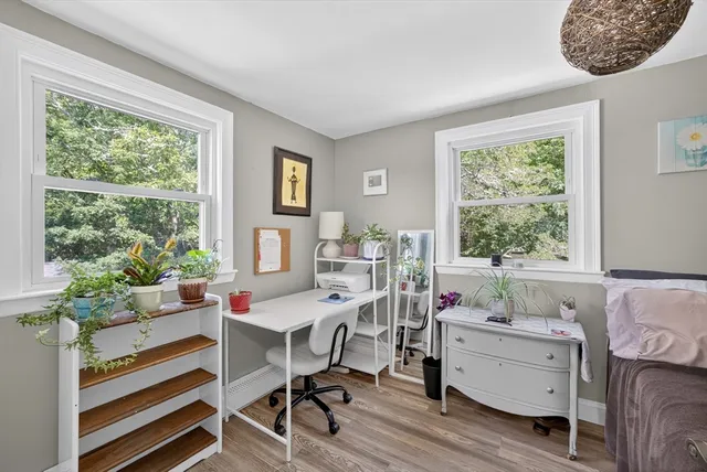 a workspace with furniture and a window