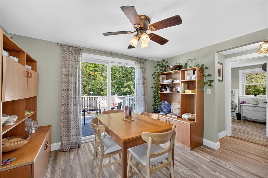 181 Head Of The Bay Road Bourne, MA 02532 - Photo 12 of 34 a dining room with furniture and wooden floor