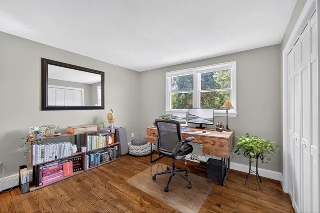 a workspace with furniture and a window