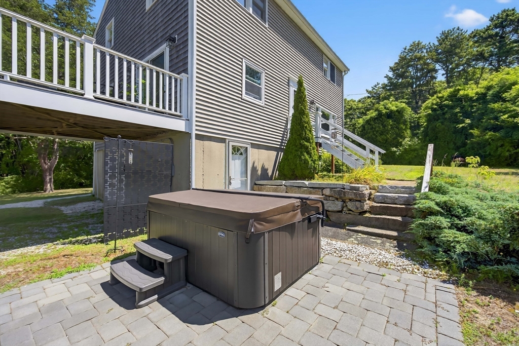 181 Head Of The Bay Road Bourne, MA 02532 - Photo 21 of 34 a view of a house with backyard and sitting area