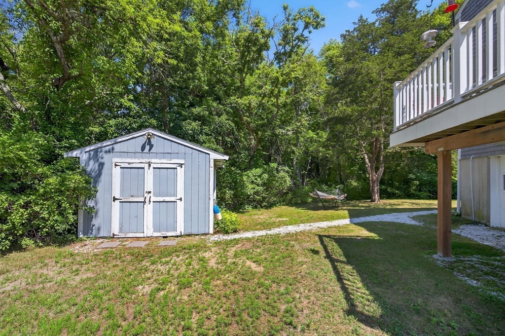 181 Head Of The Bay Road Bourne, MA 02532 - Photo 25 of 34 a view of a front of house with a yard
