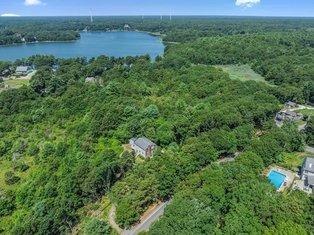 an aerial view of a house with outdoor space and street view