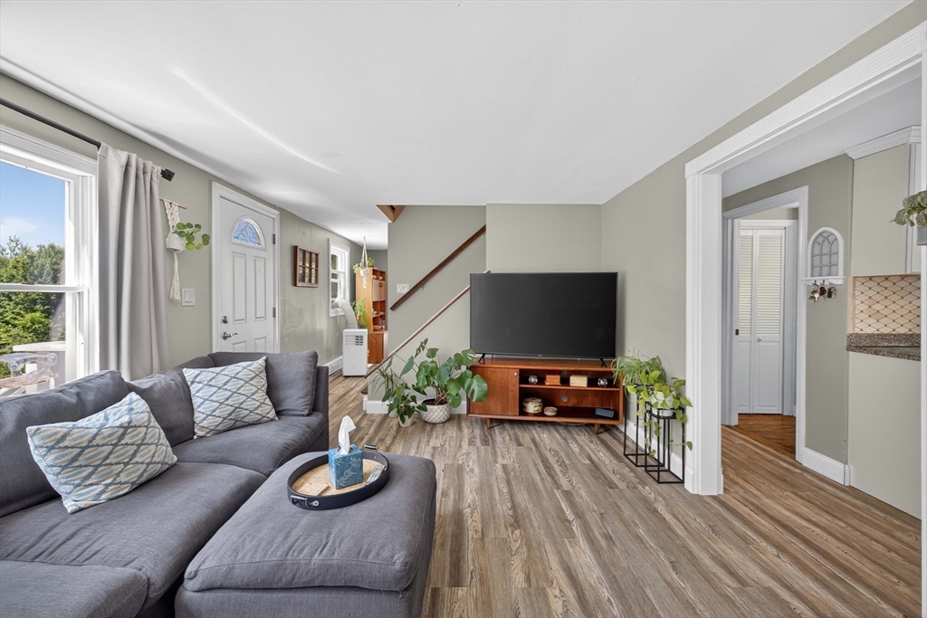 181 Head Of The Bay Road Bourne, MA 02532 - Photo 8 of 34 a living room with furniture and a flat screen tv
