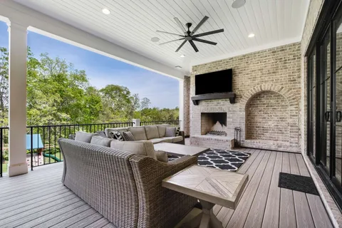a view of a livingroom with furniture window and wooden floor