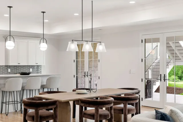 a work room with furniture and a floor to ceiling window