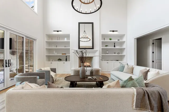 a living room with furniture and a fireplace