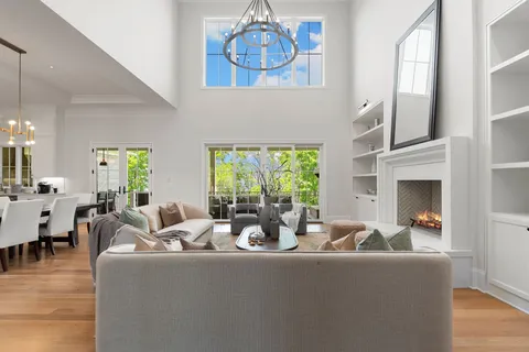a living room with furniture and kitchen view