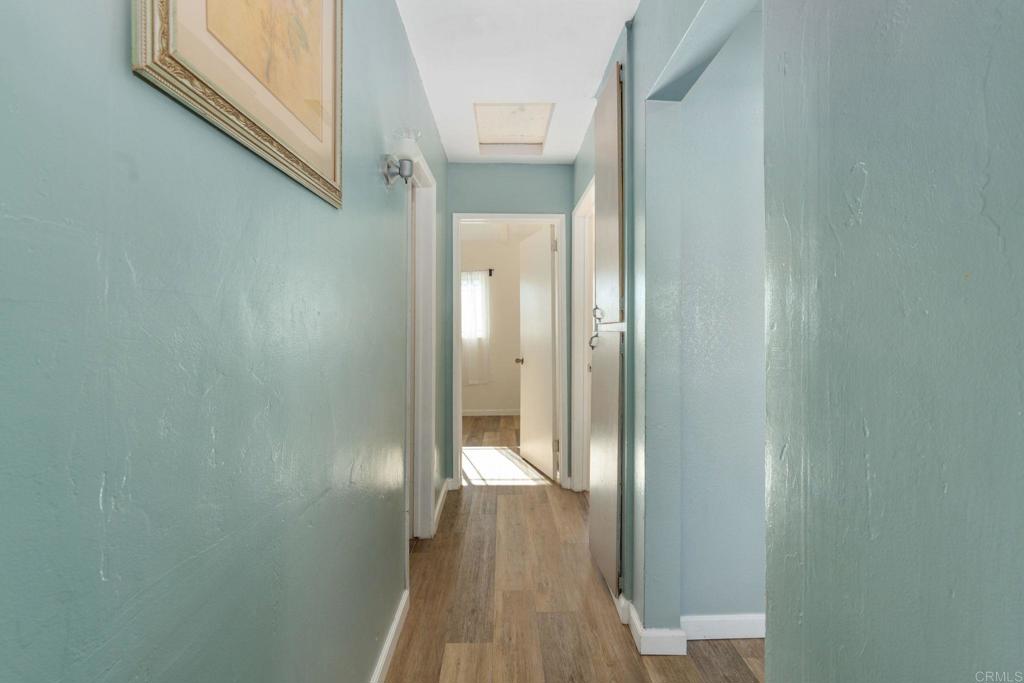 512 Tatum Street Vista, CA 92083 - Photo 12 of 26 a view of a hallway with wooden floor