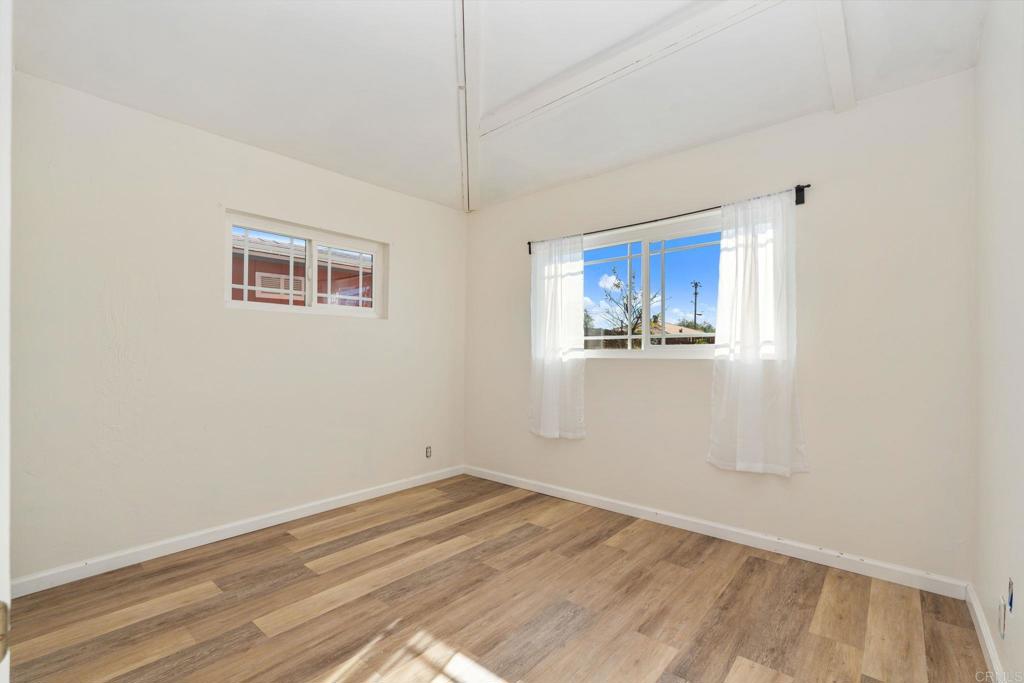 512 Tatum Street Vista, CA 92083 - Photo 14 of 26 a view of a room with wooden floor and window