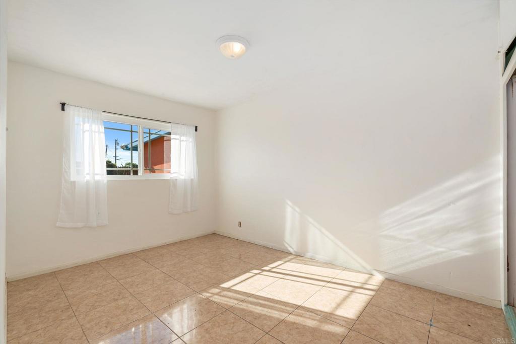 512 Tatum Street Vista, CA 92083 - Photo 15 of 26 a view of a big room with closet and windows
