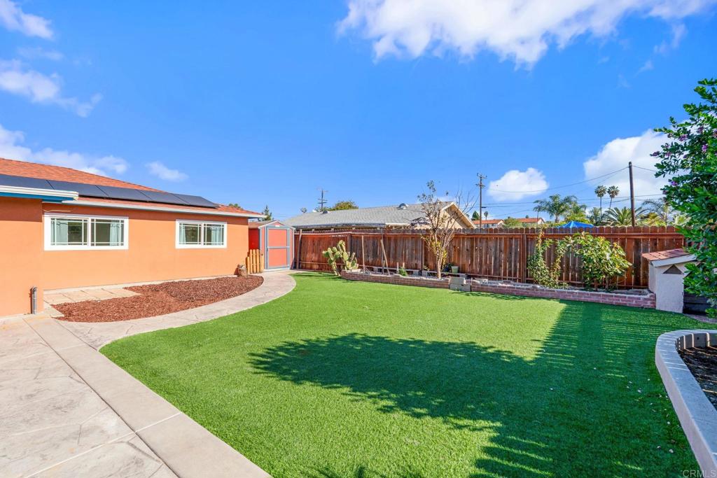 512 Tatum Street Vista, CA 92083 - Photo 21 of 26 a view of a house with backyard and a tree