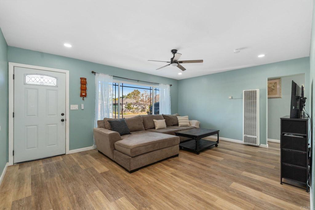 512 Tatum Street Vista, CA 92083 - Photo 6 of 26 a living room with furniture and a wooden floor