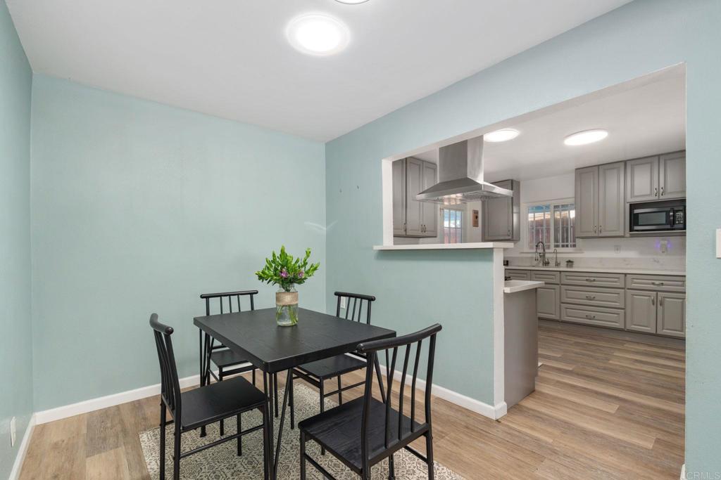 512 Tatum Street Vista, CA 92083 - Photo 7 of 26 a view of a dining room with furniture and wooden floor