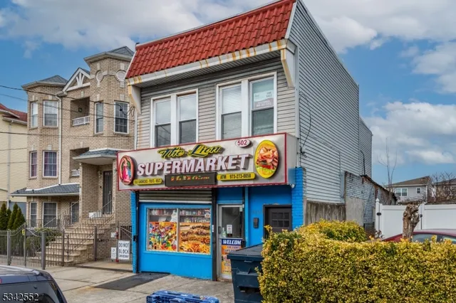 a front view of a building with retail shops
