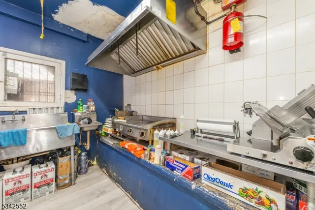 a bathroom with a sink toilet and a mirror