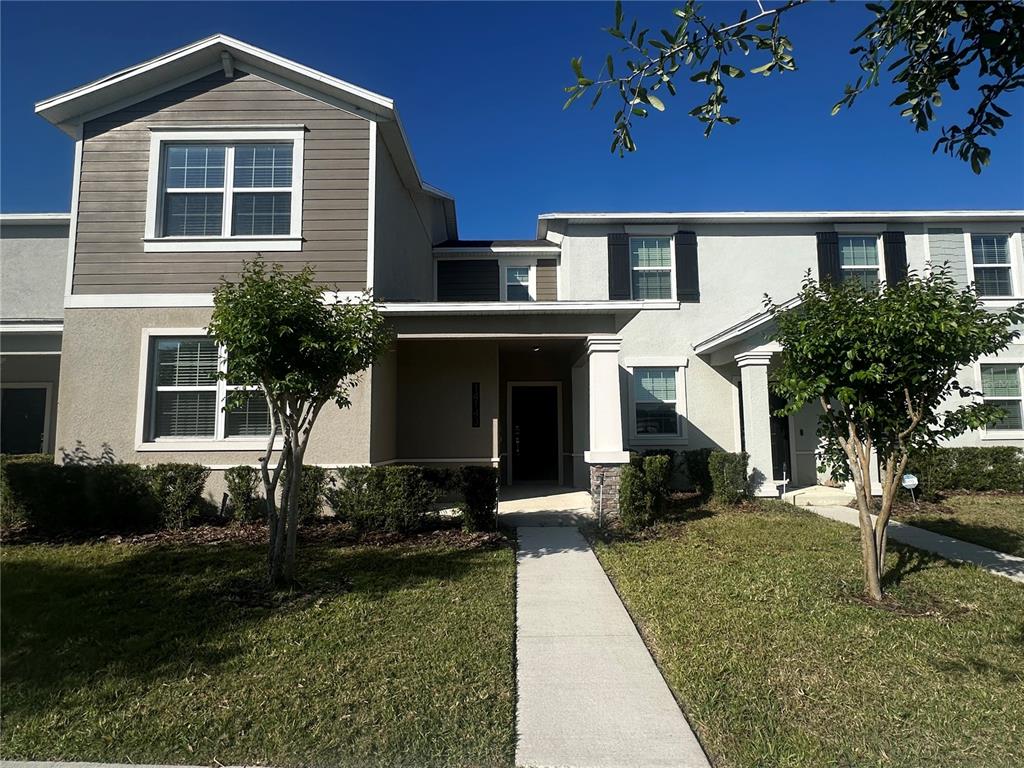 14143 Title Way Winter Garden, FL 34787 - Photo 1 of 1 a front view of a house with a yard