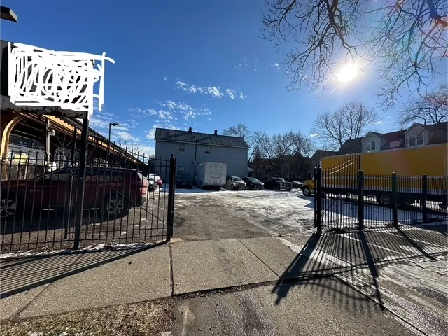 a view of a patio with a table and chairs