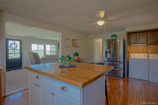 a kitchen with refrigerator and window