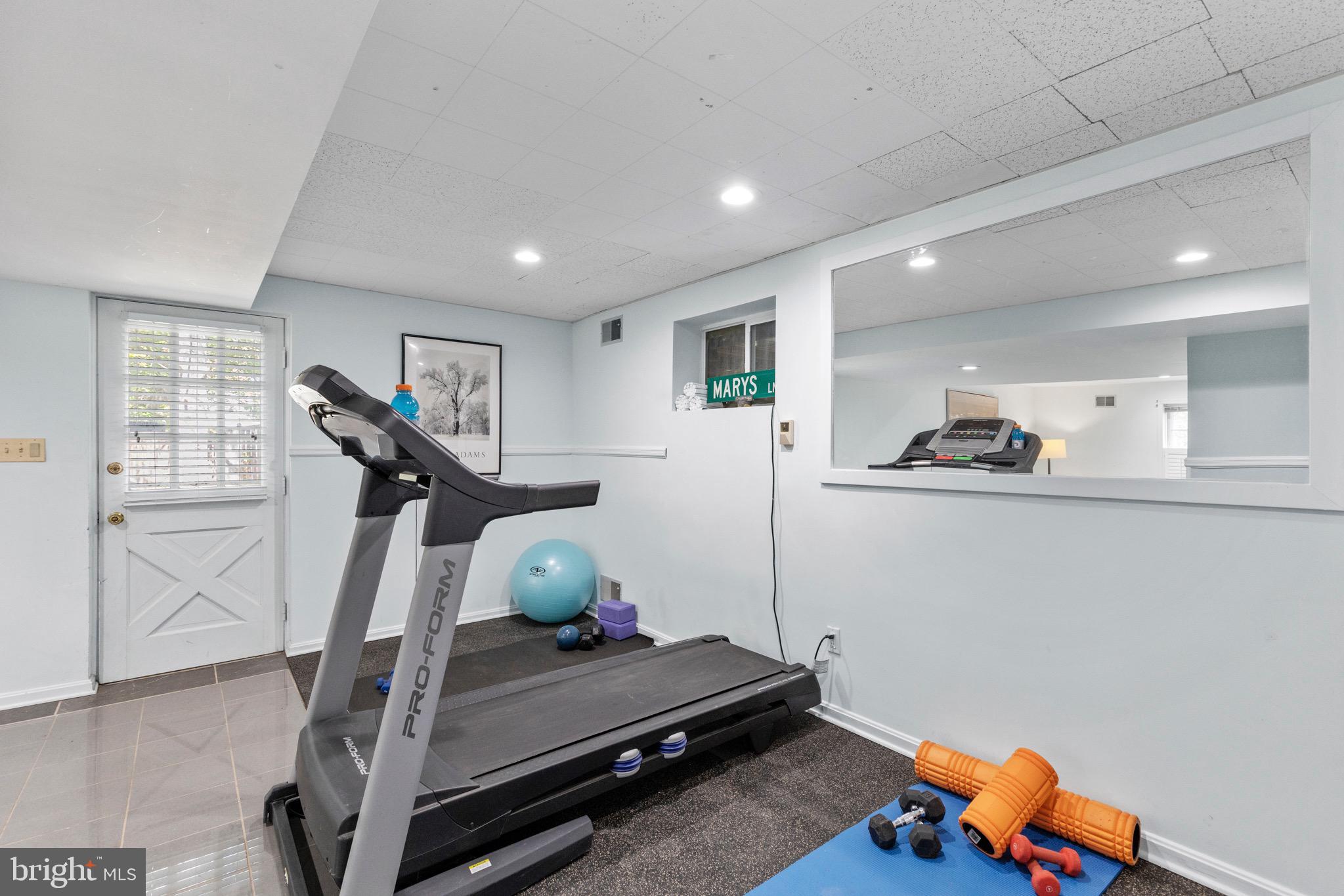 13613 Query Mill Road North Potomac, MD 20878 - Photo 55 of 87 Lower Level Workout Area w/ Wet Bar