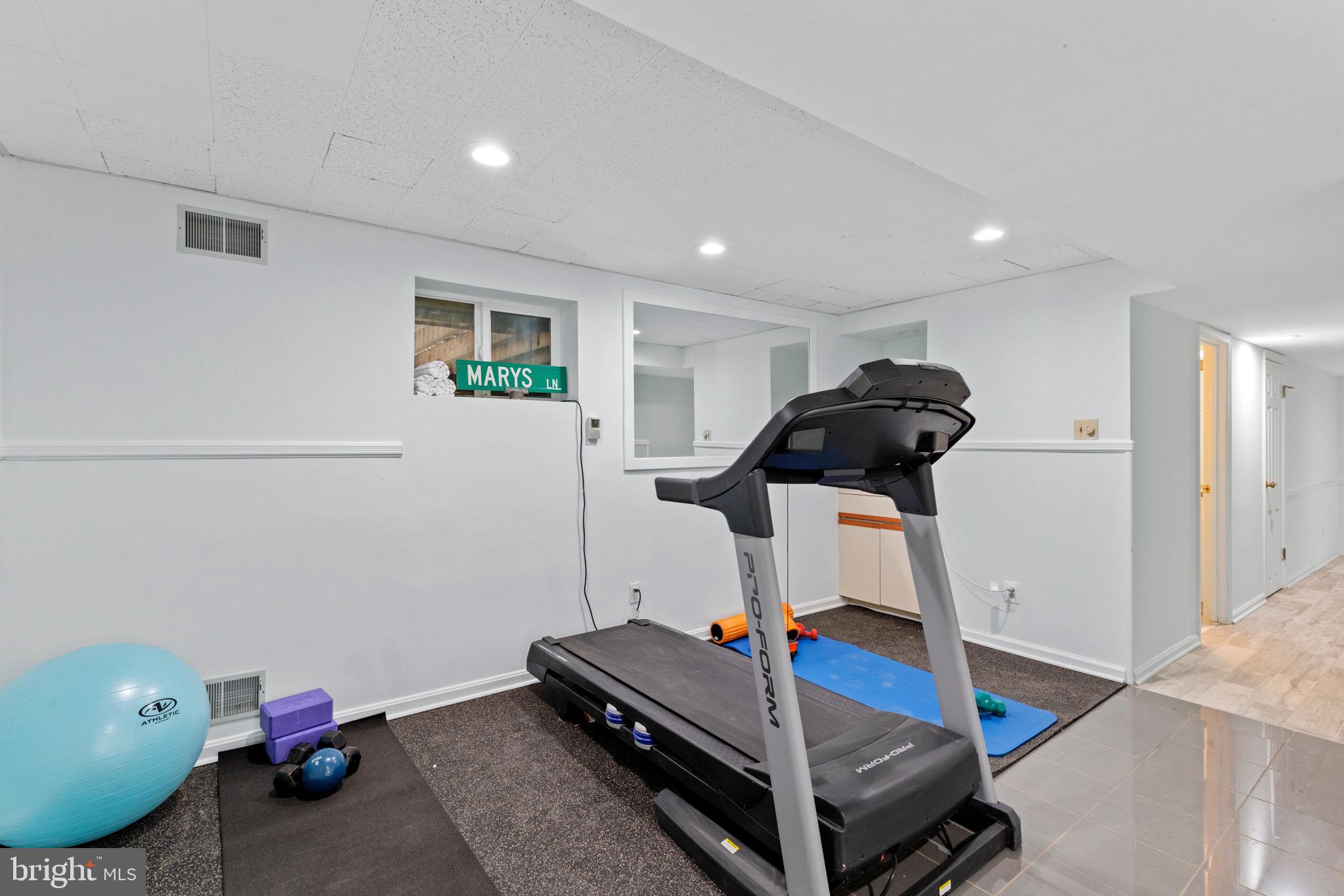 13613 Query Mill Road North Potomac, MD 20878 - Photo 56 of 87 Lower Level Workout Area w/ Wet Bar