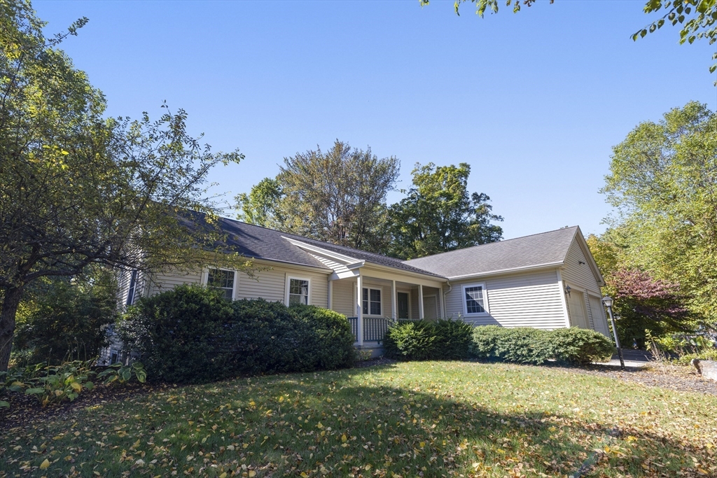 11 Sheerman Lane Amherst, MA 01002 - Photo 2 of 37 a front view of a house with a yard and garage