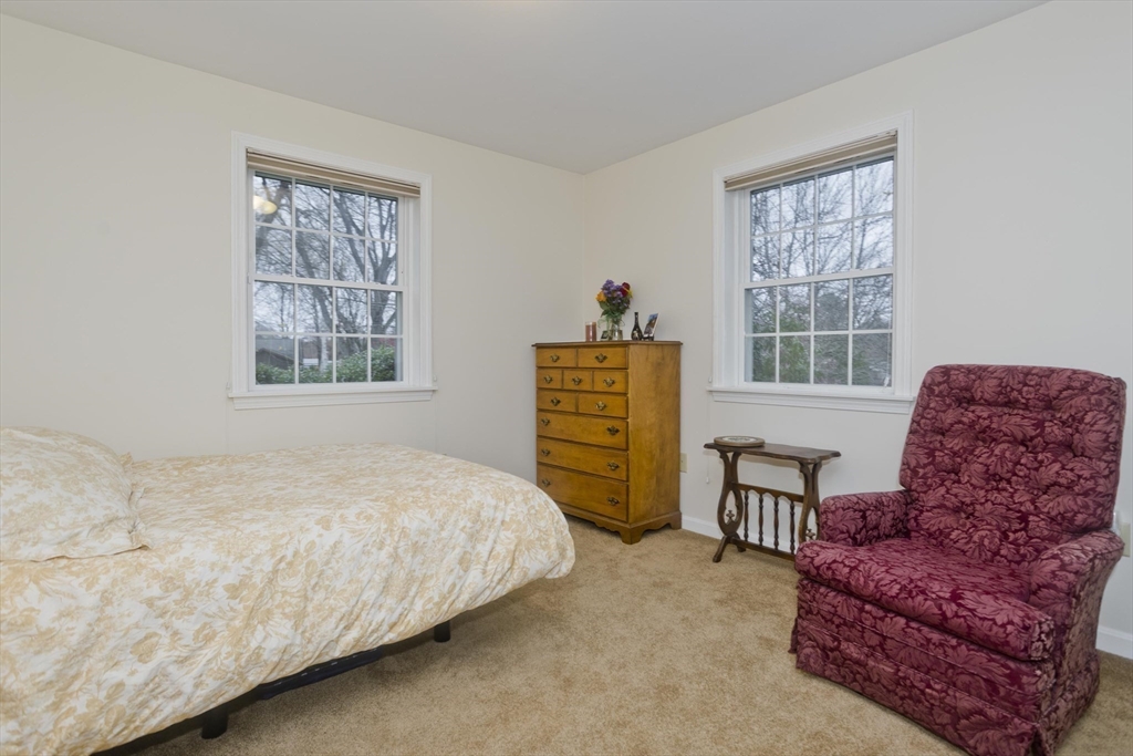 11 Sheerman Lane Amherst, MA 01002 - Photo 23 of 37 a bedroom with furniture and a window