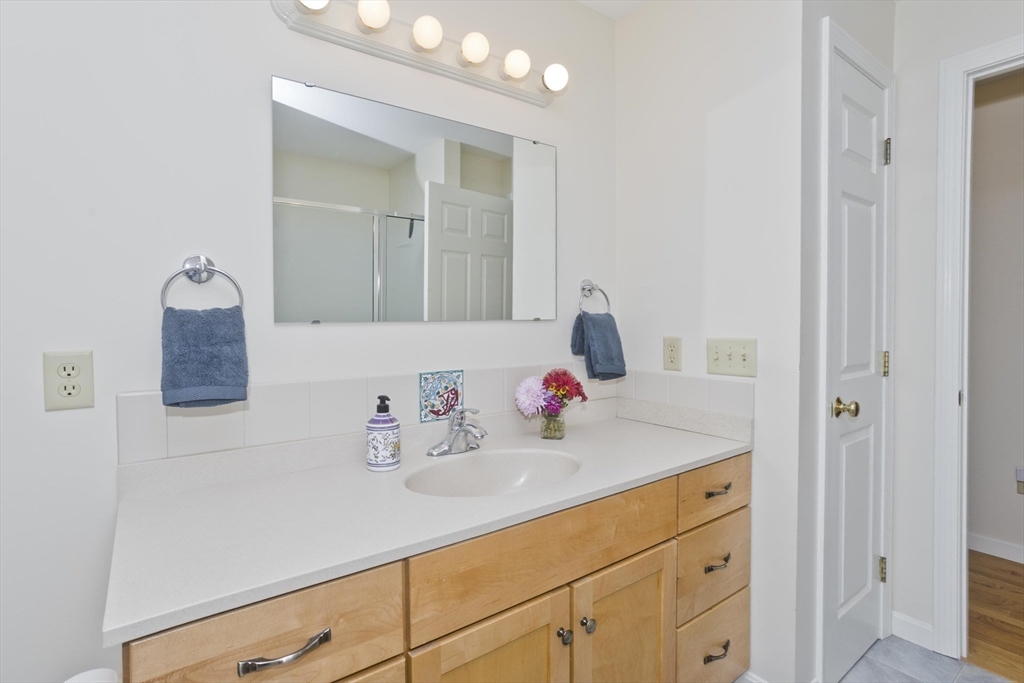 11 Sheerman Lane Amherst, MA 01002 - Photo 26 of 37 a bathroom with a sink vanity and mirror