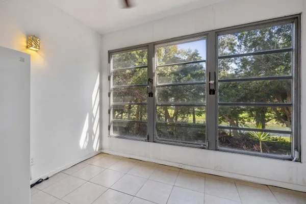 a view of empty room with floor to ceiling window