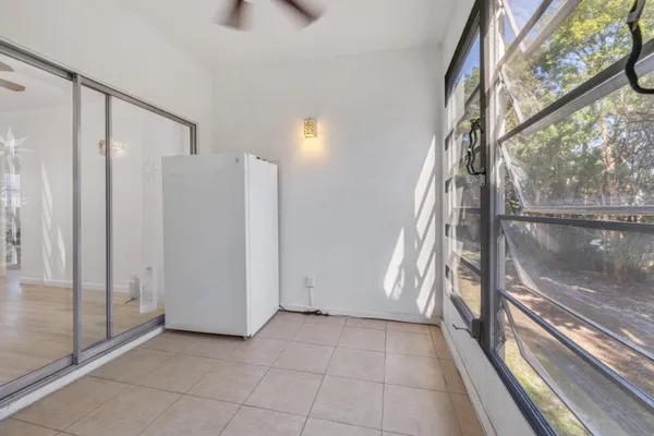 a view of an entryway with a floor to ceiling window