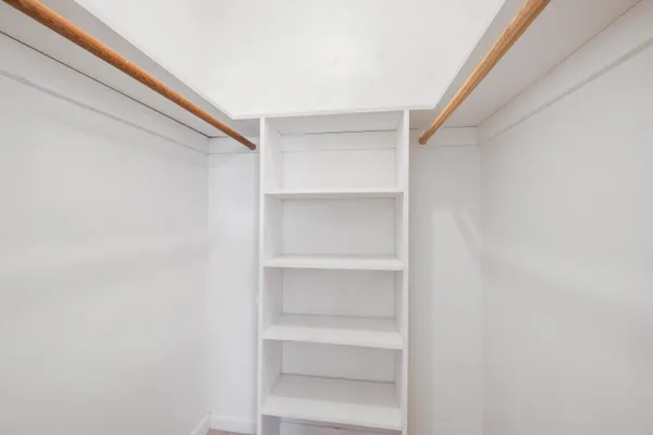 a view of an empty walk in closet
