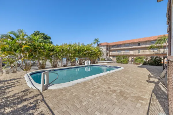 a view of swimming pool from a balcony
