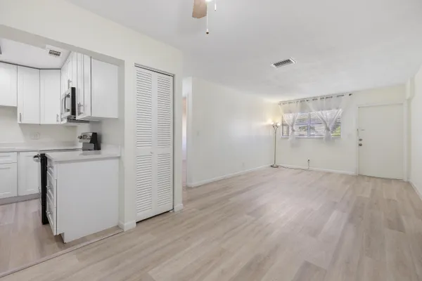 a view of kitchen with wooden floor