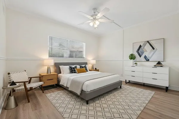 a bedroom with a bed and window