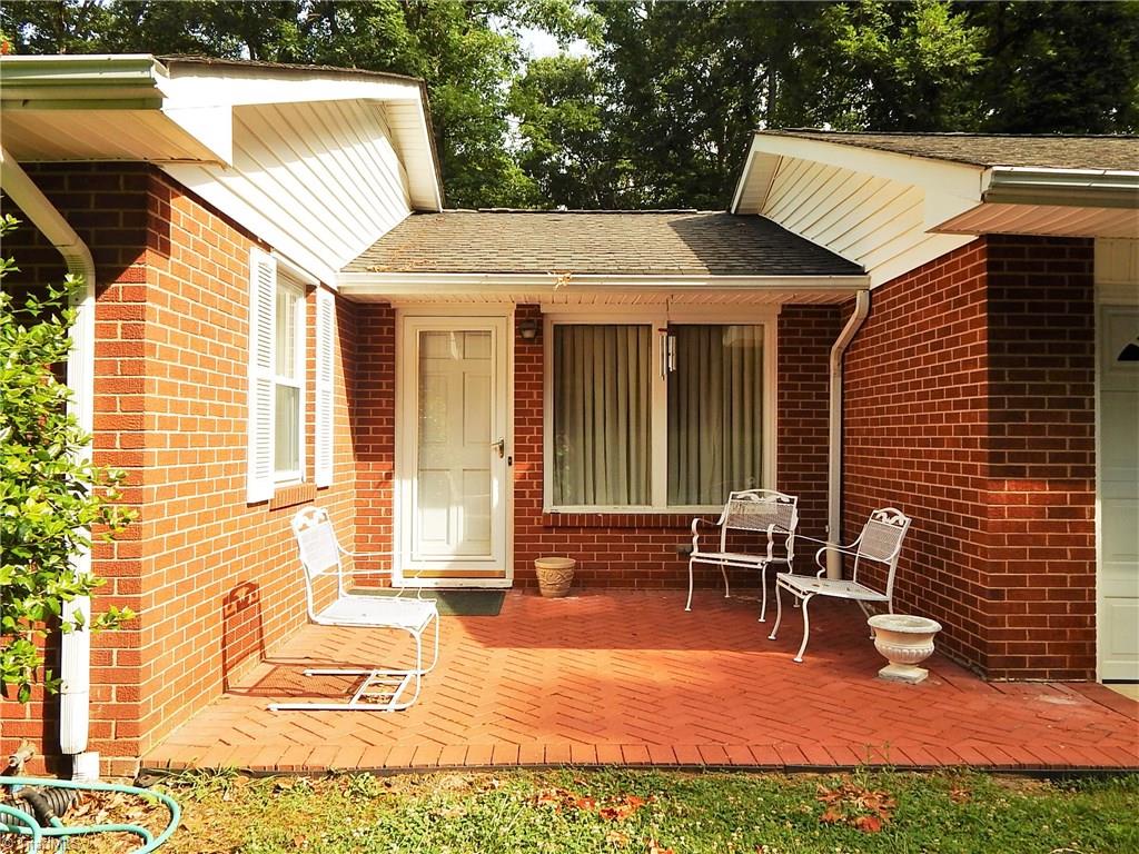 965 Dan Valley Road Madison, NC 27025 - Photo 22 of 30 Brick patio with view of back yard