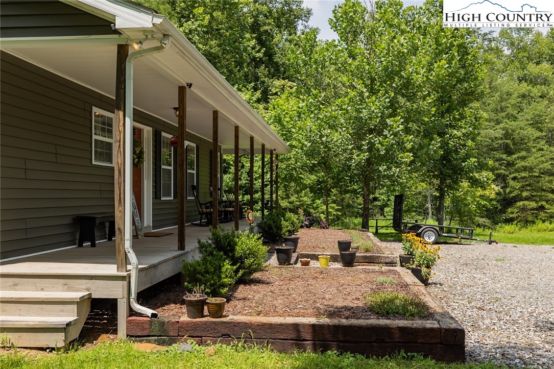 351 Colony Lane Purlear, NC 28665 - Photo 11 of 39 a front view of a house with garden