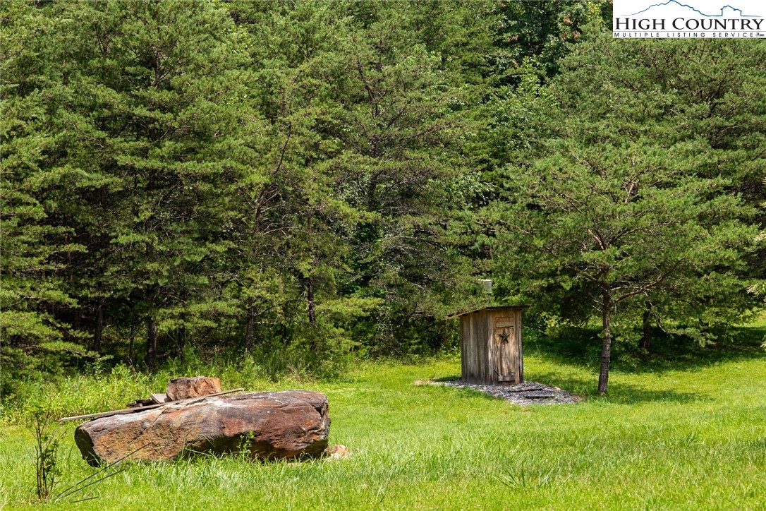 351 Colony Lane Purlear, NC 28665 - Photo 17 of 39 a backyard of a house with a yard and outdoor seating