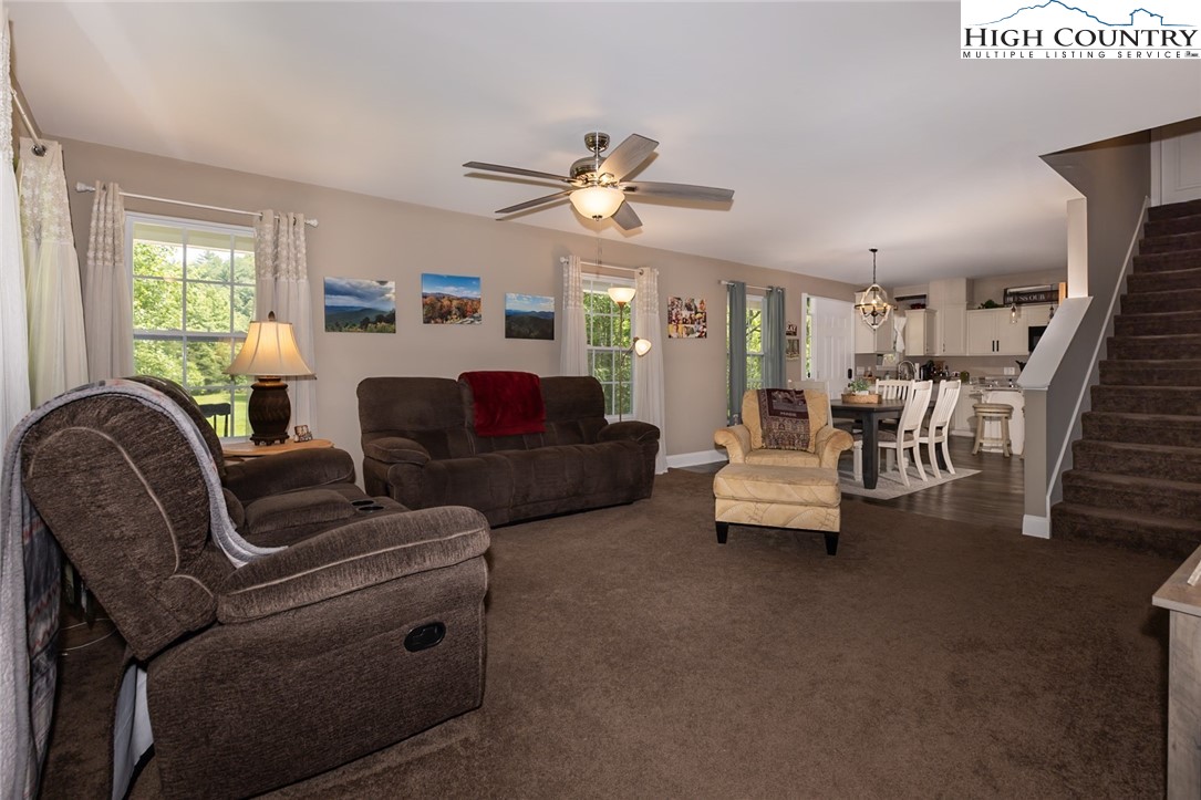 351 Colony Lane Purlear, NC 28665 - Photo 20 of 39 a living room with furniture and a chandelier
