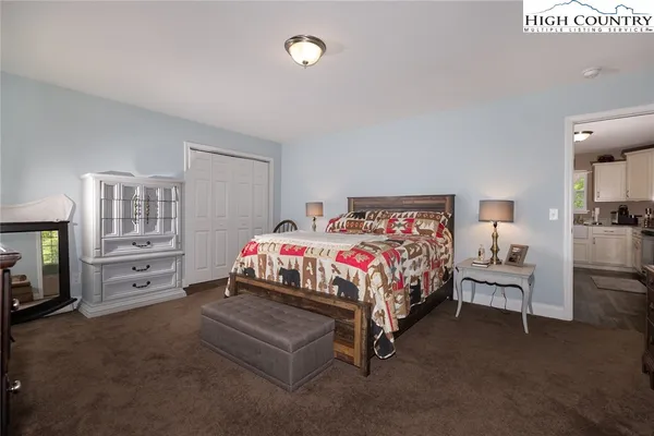 a bedroom with a bed and a couch
