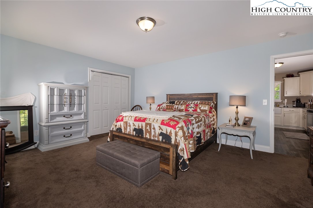 351 Colony Lane Purlear, NC 28665 - Photo 27 of 39 a bedroom with a bed and a couch
