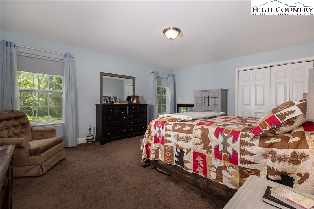 351 Colony Lane Purlear, NC 28665 - Photo 29 of 39 a bedroom with a bed and window