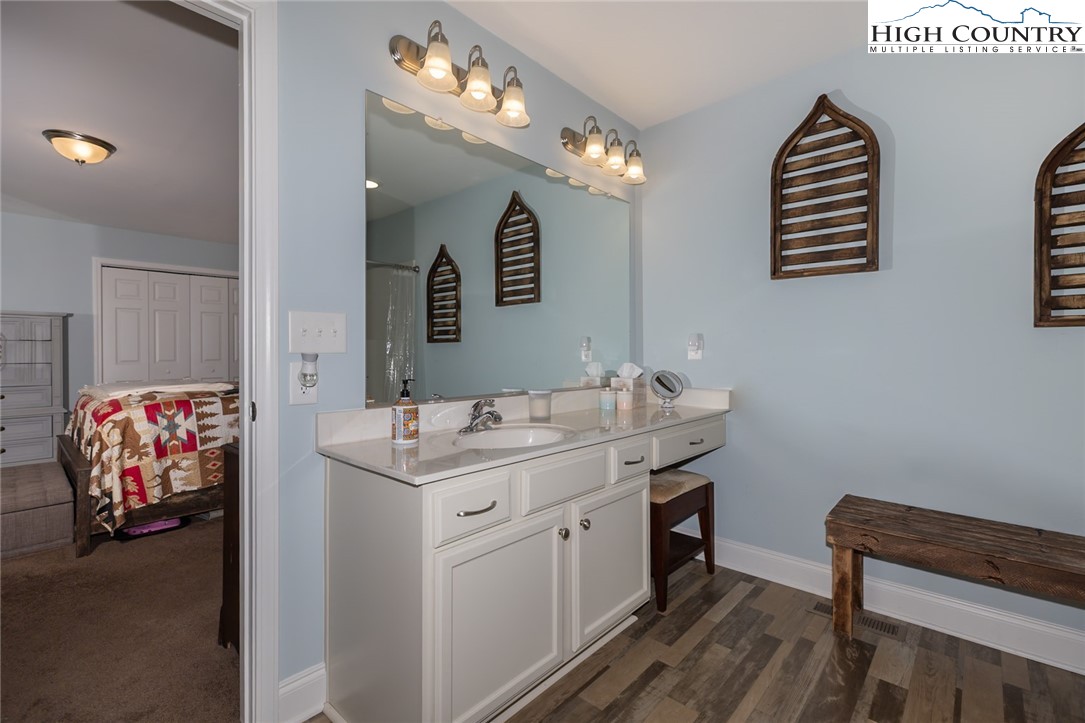 351 Colony Lane Purlear, NC 28665 - Photo 30 of 39 a bathroom with a sink a vanity and a mirror