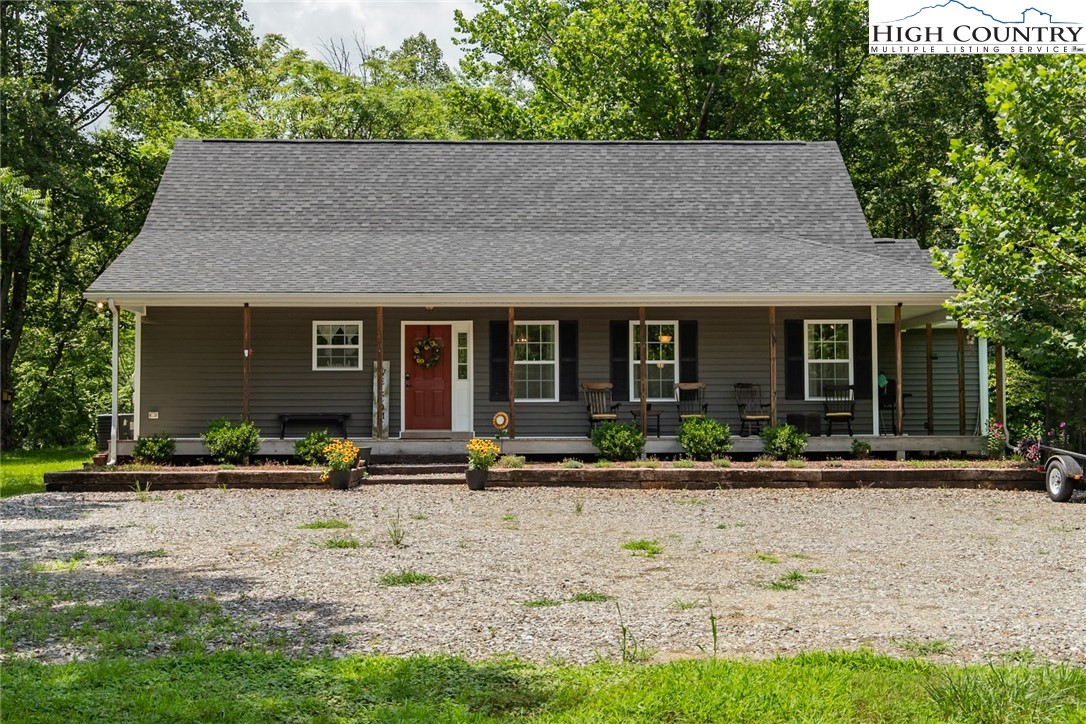 351 Colony Lane Purlear, NC 28665 - Photo 3 of 39 a front view of house with yard and green space