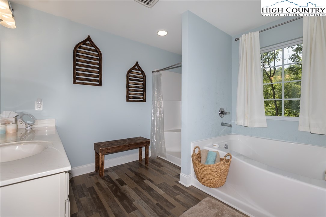 351 Colony Lane Purlear, NC 28665 - Photo 31 of 39 a bathroom with a sink and a bathtub