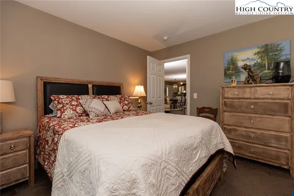 a bed room with a bed and a mirror