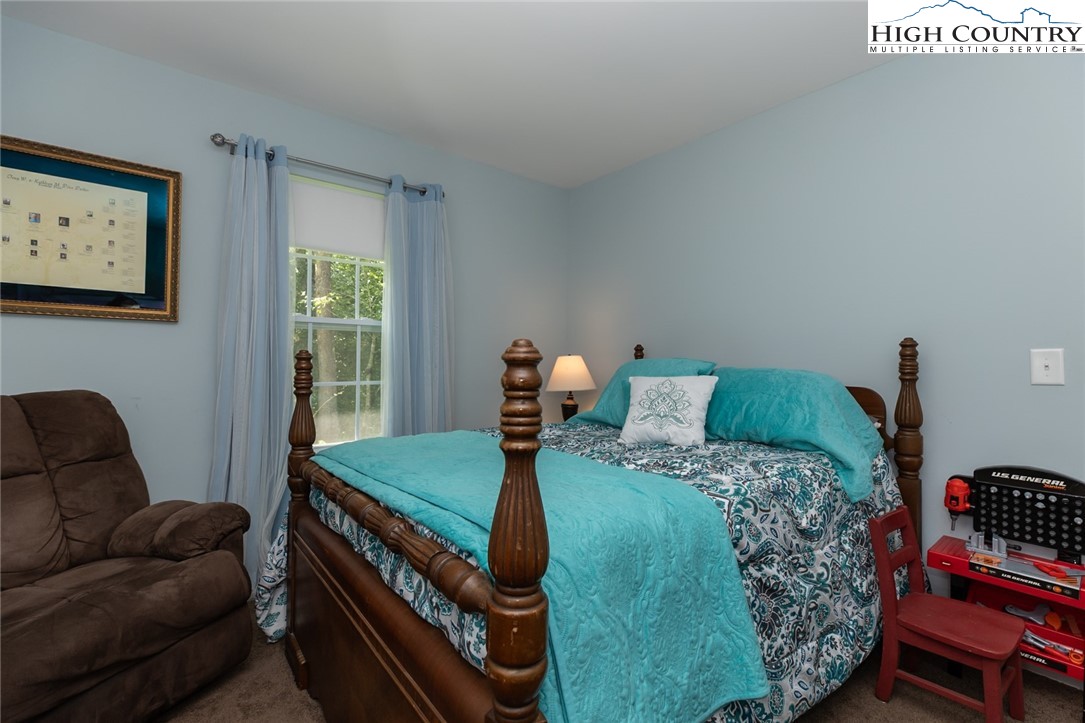 351 Colony Lane Purlear, NC 28665 - Photo 37 of 39 a bed room with a bed and a couch