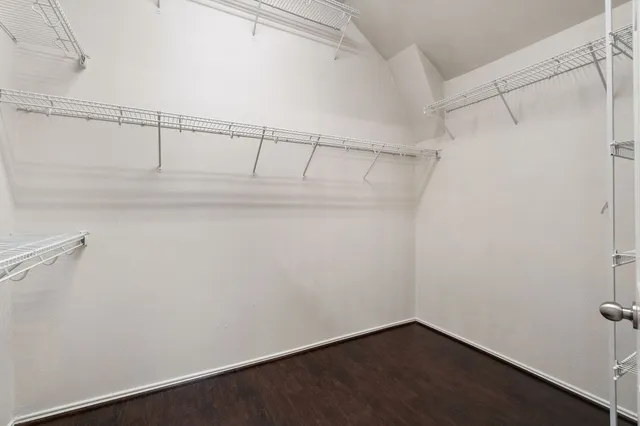 a en suite bathroom with a granite countertop sink mirror and bathtub