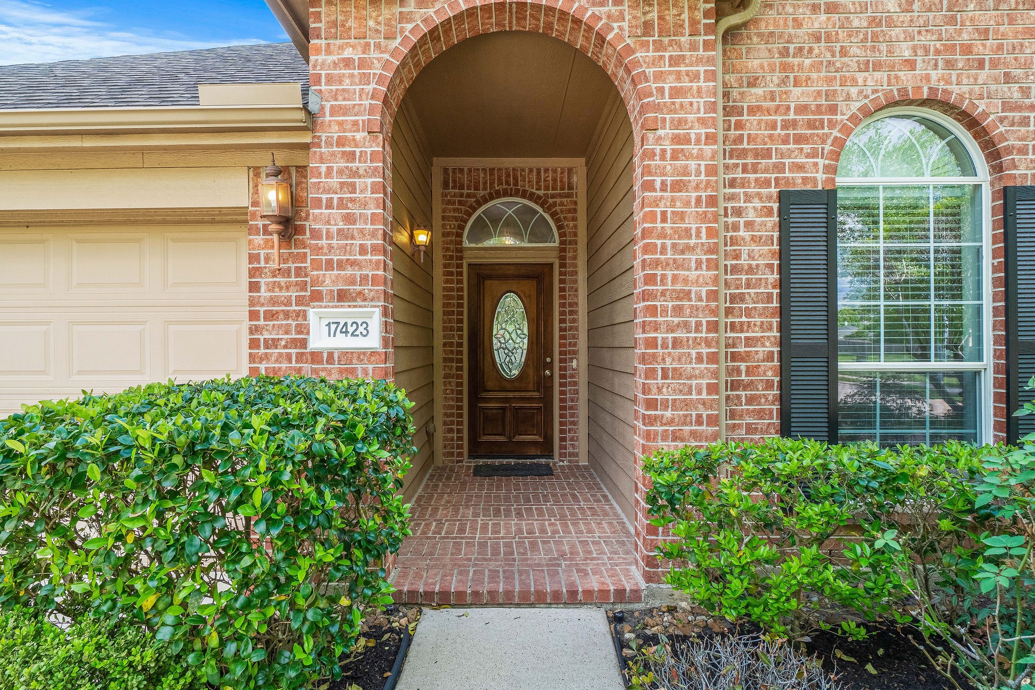 17423 Renee Springs Court Spring, TX 77379 - Photo 2 of 19 a front view of a house with garden